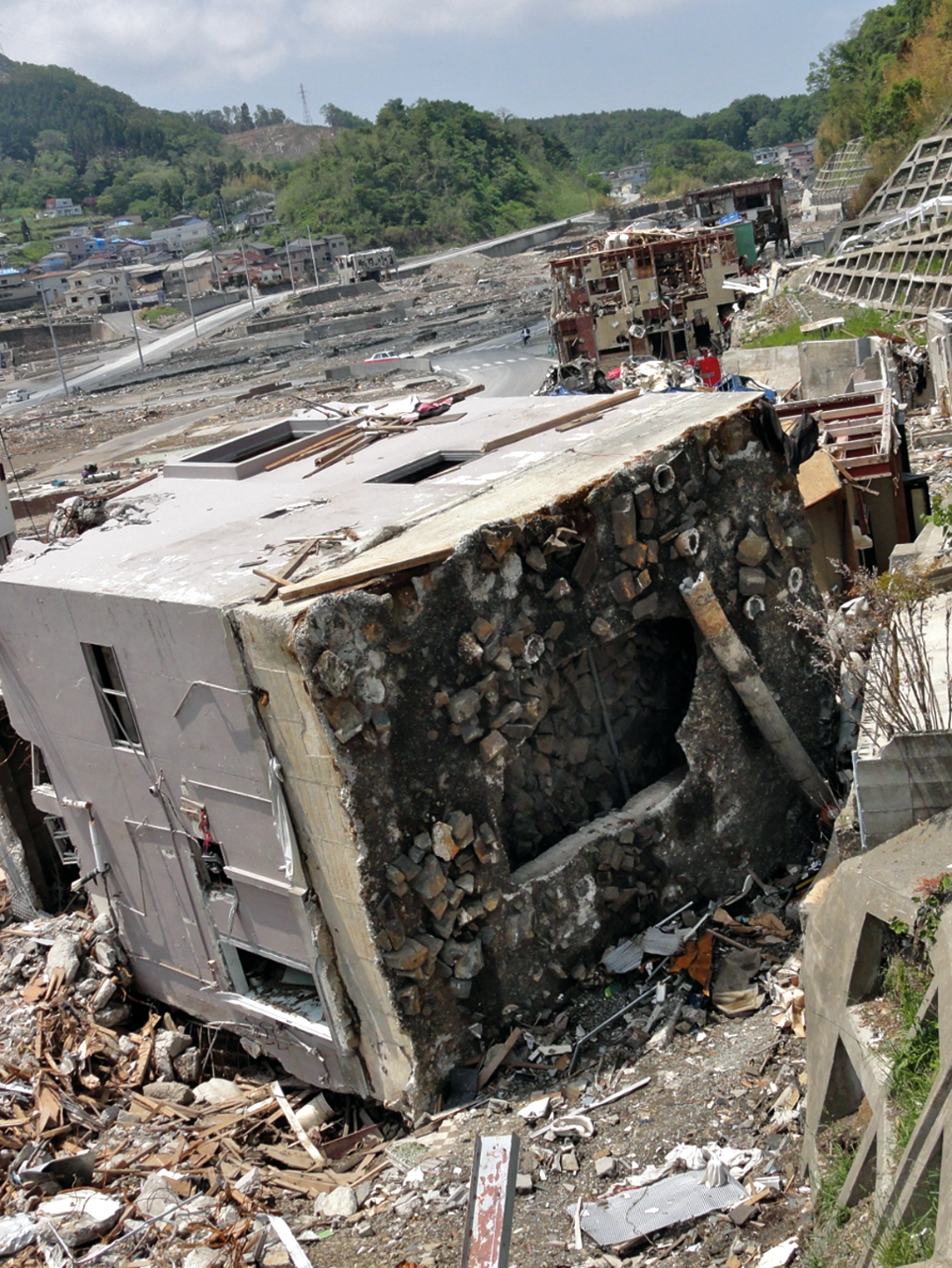 3-story buildings overturned during 11 March 2011 Japan tsunami. Onagawa, Japan.  Photo courtesy of ITIC.